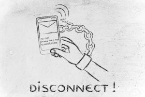 hand chained to a mobile with text Disconnect!!
